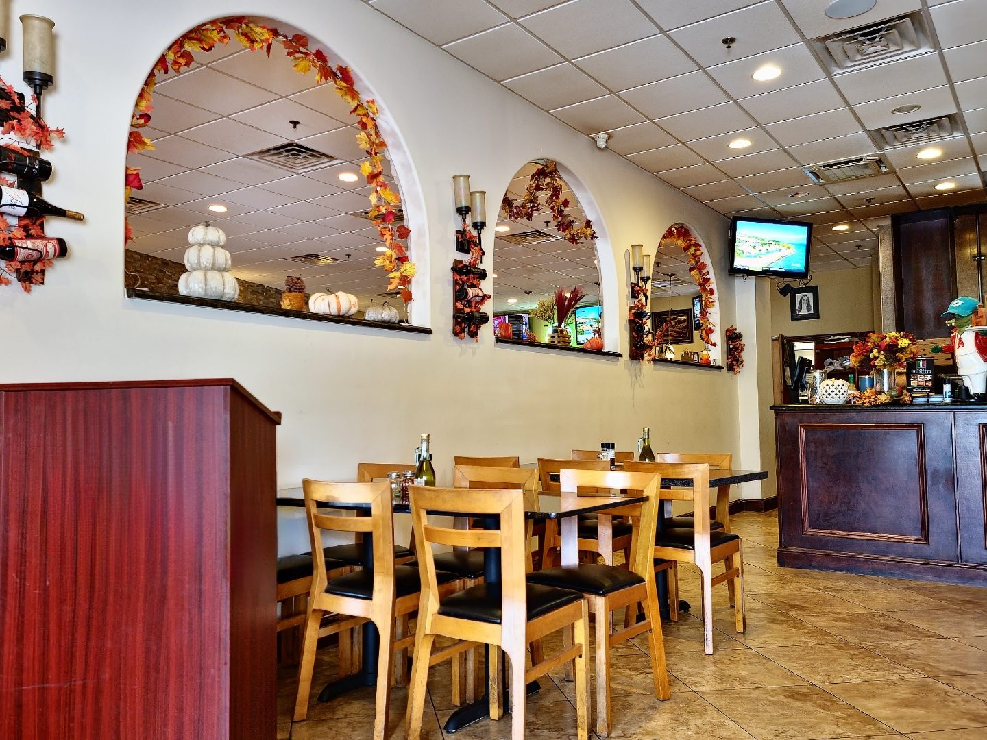 The warm dining room with its decorative wall arches