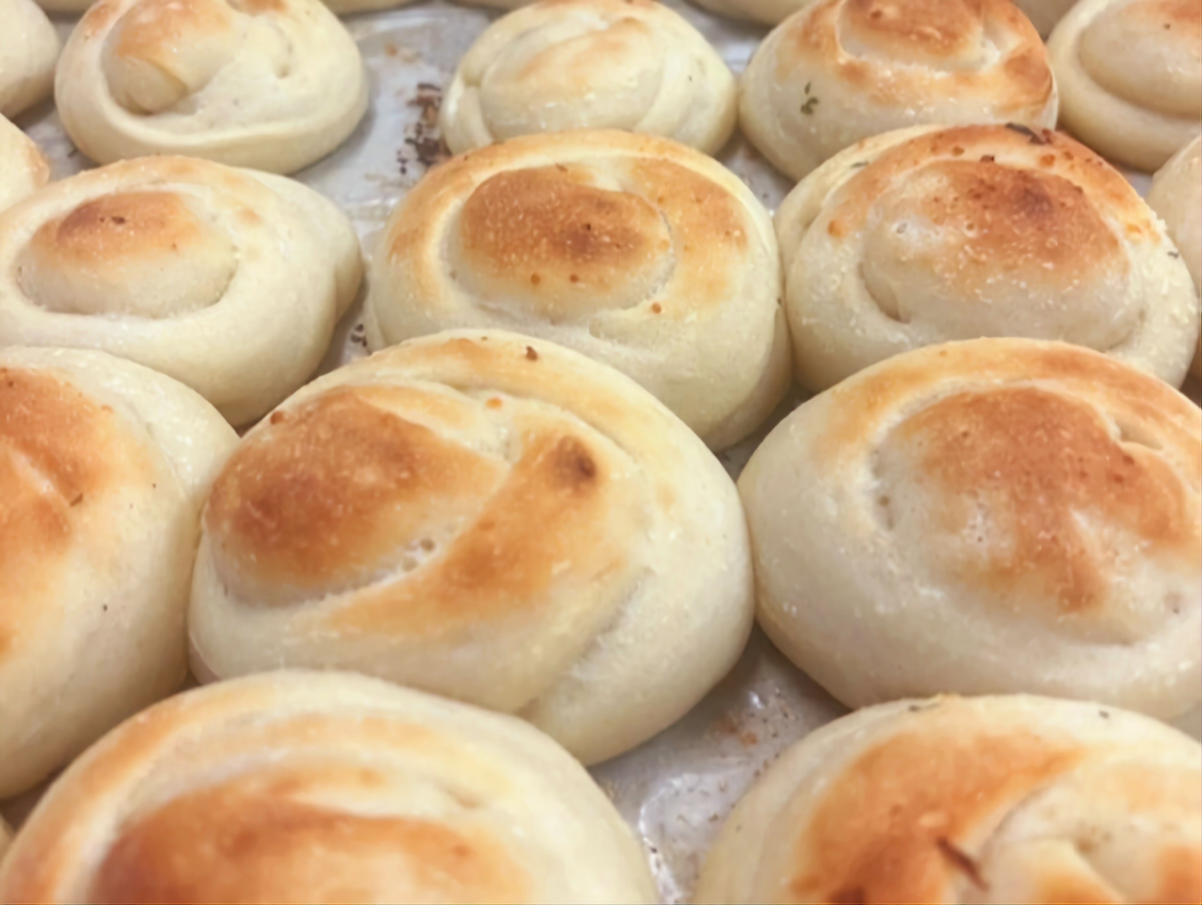 A tray of golden garlic knots